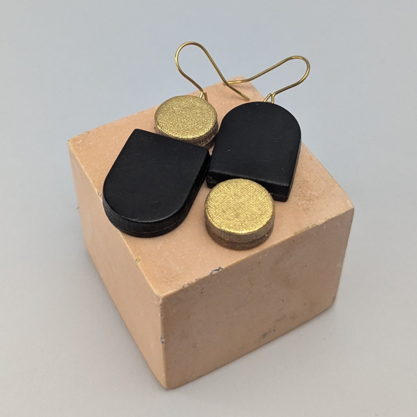 Leather totem earring in black and gold by Kay Morgan, Bristol