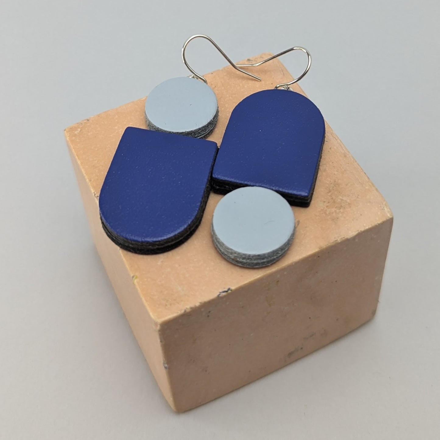 Leather totem earring in royal blue and pale blue by Kay Morgan, Bristol