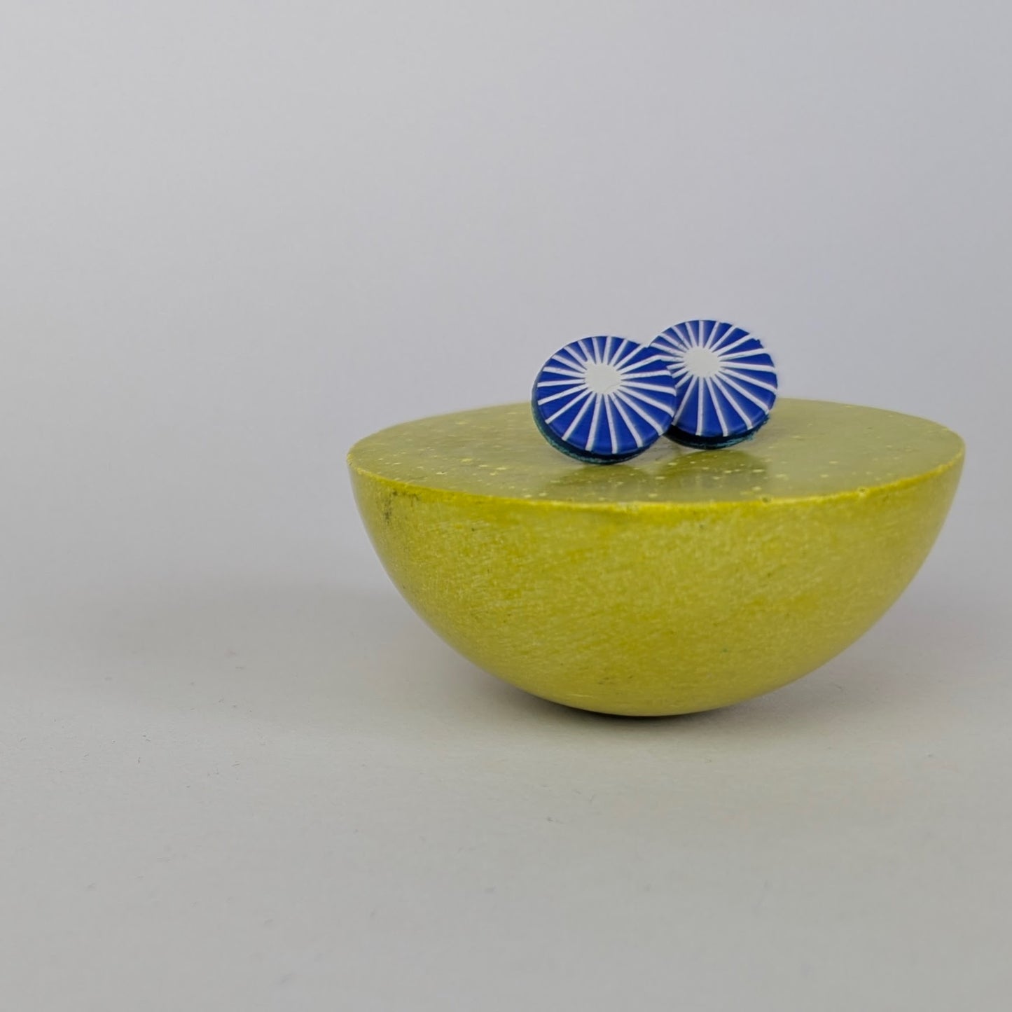 Patterned small circle studs.
