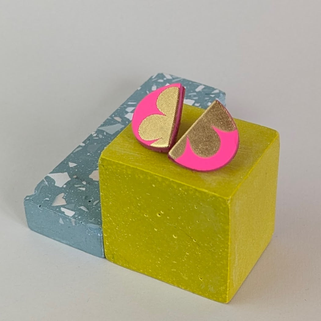 PATTERNED SEMI CIRCLE STUDS.