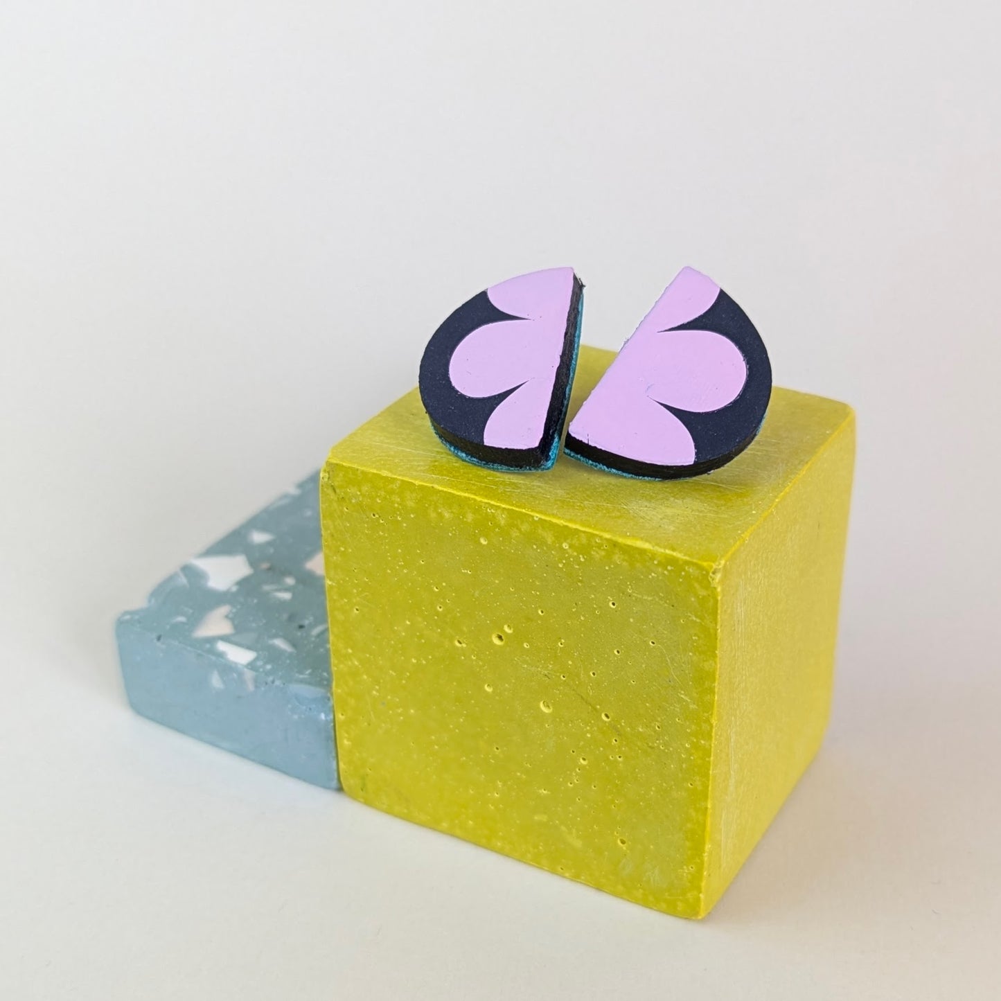PATTERNED SEMI CIRCLE STUDS.