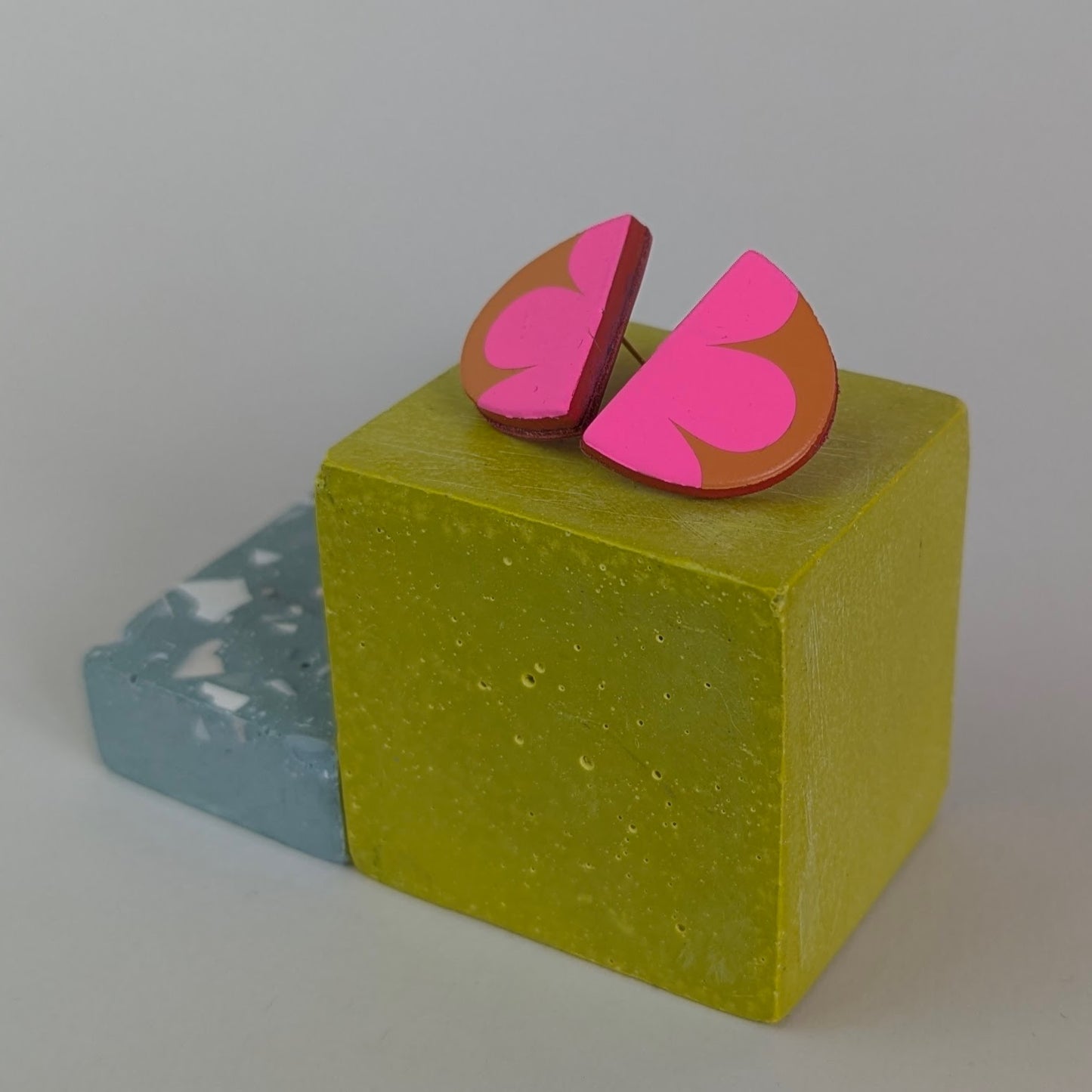 PATTERNED SEMI CIRCLE STUDS.
