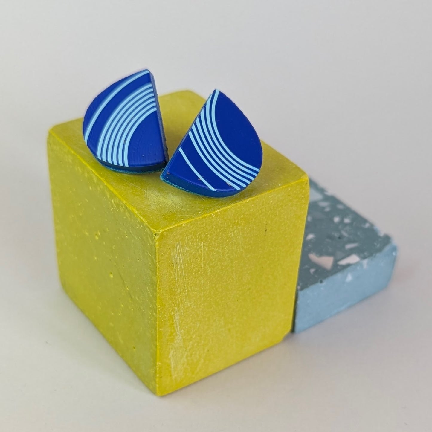 PATTERNED SEMI CIRCLE STUDS.