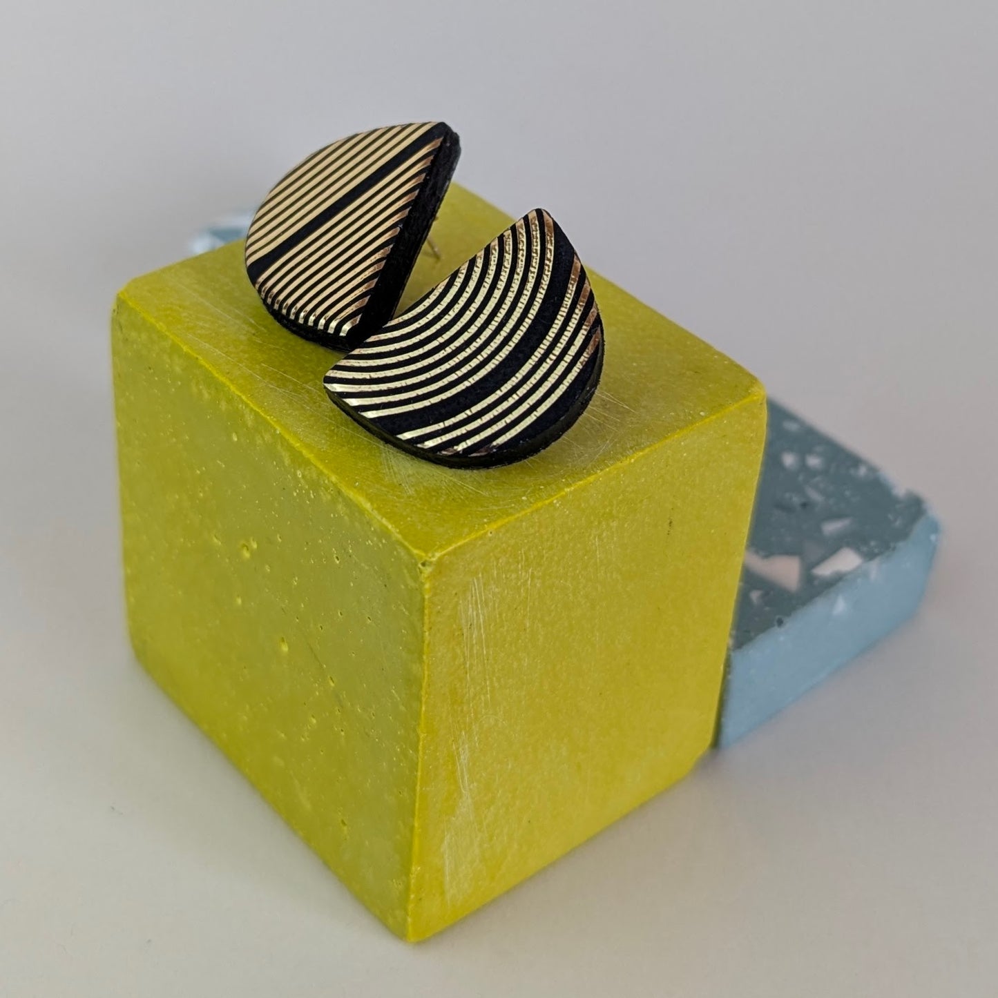 PATTERNED SEMI CIRCLE STUDS.