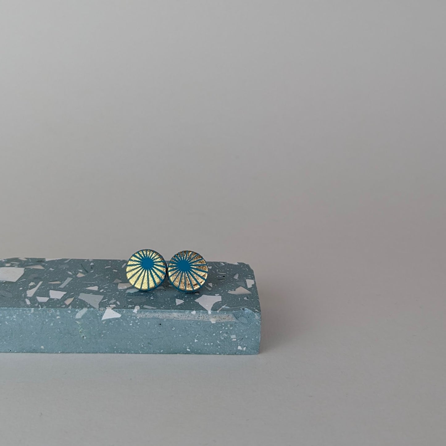 Patterned small circle studs.
